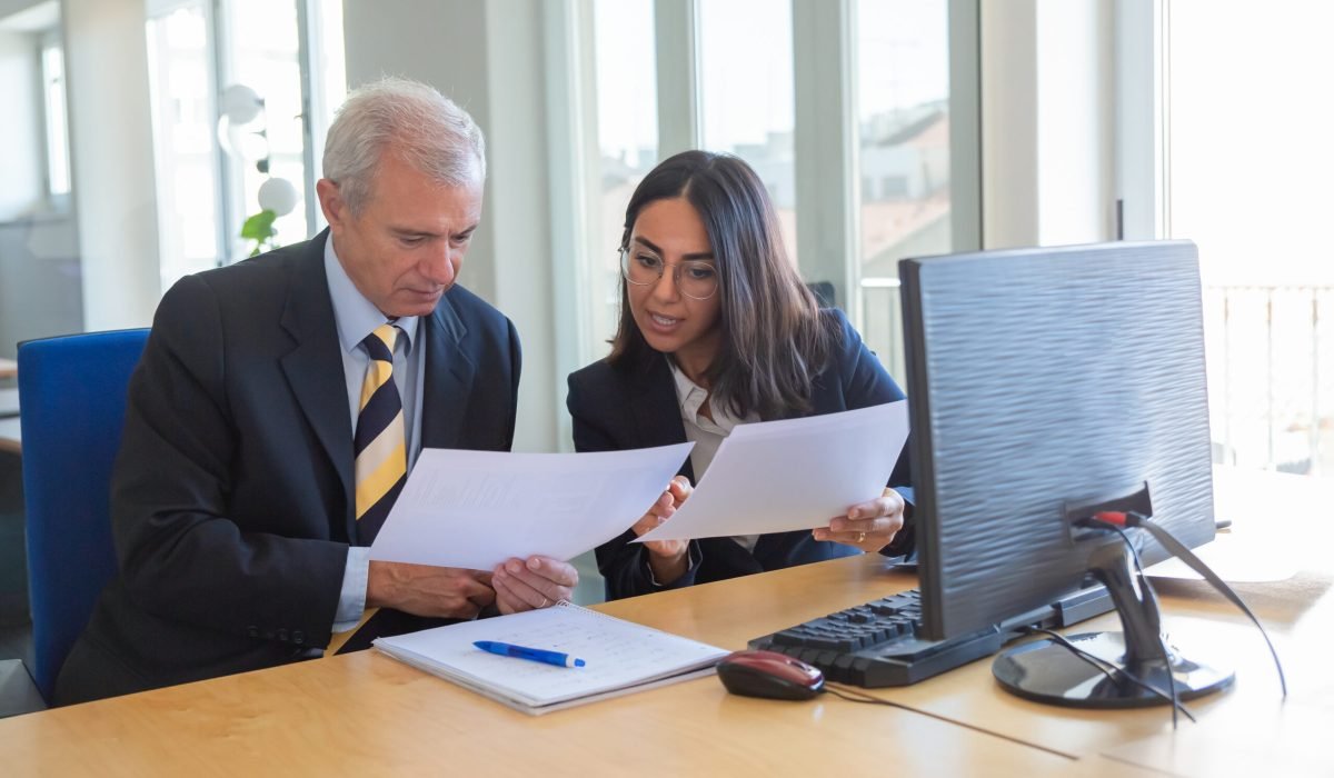 female professional explaining document details